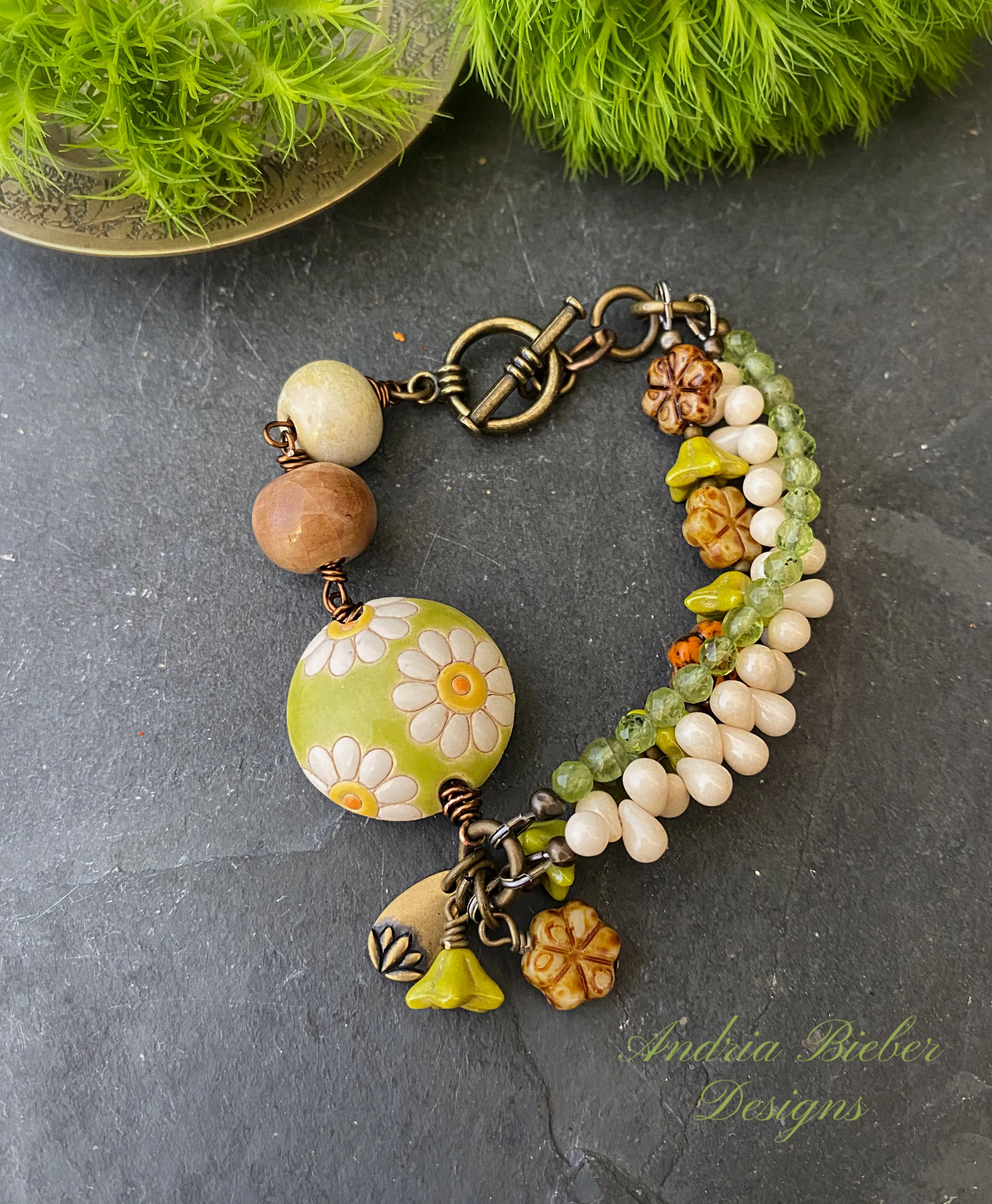 Daisies. Peridot stone, Czech glass flowers, ceramic beads, brinze metal, multi strand, bracelet