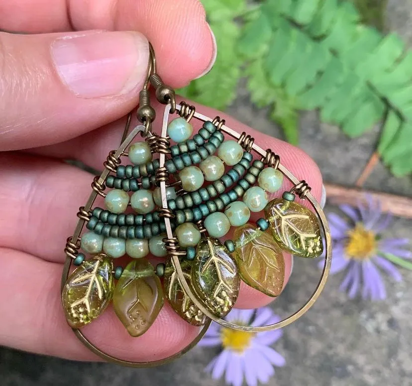 Green Czech glass leaves. Bronze metal hoops, wire wrapped, earrings